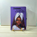 Notebook with a purple cover featuring an illustration of a woman and text, on a white background.