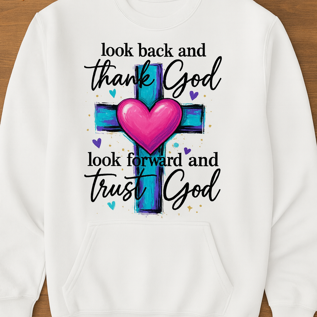 White sweatshirt with a cross and heart design on a wooden background