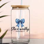 Clear glass tumbler with a blue bow and 'She is worthy Proverbs 31' text on a light background
