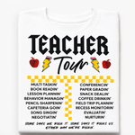 A white short-sleeve t-shirt with a graphic print that reads 'TEACHER Tour' in black lettering, decorated with red apples, yellow lightning bolts, and a yellow-and-white checkered pattern above a list of classroom activities. The t-shirt is displayed flat against a clean white background.