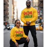 Two people wearing yellow sweatshirts with 'The Culture is the Curriculum' text on a city street.