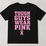 Black t-shirt with pink text and breast cancer awareness ribbon on a light gray background