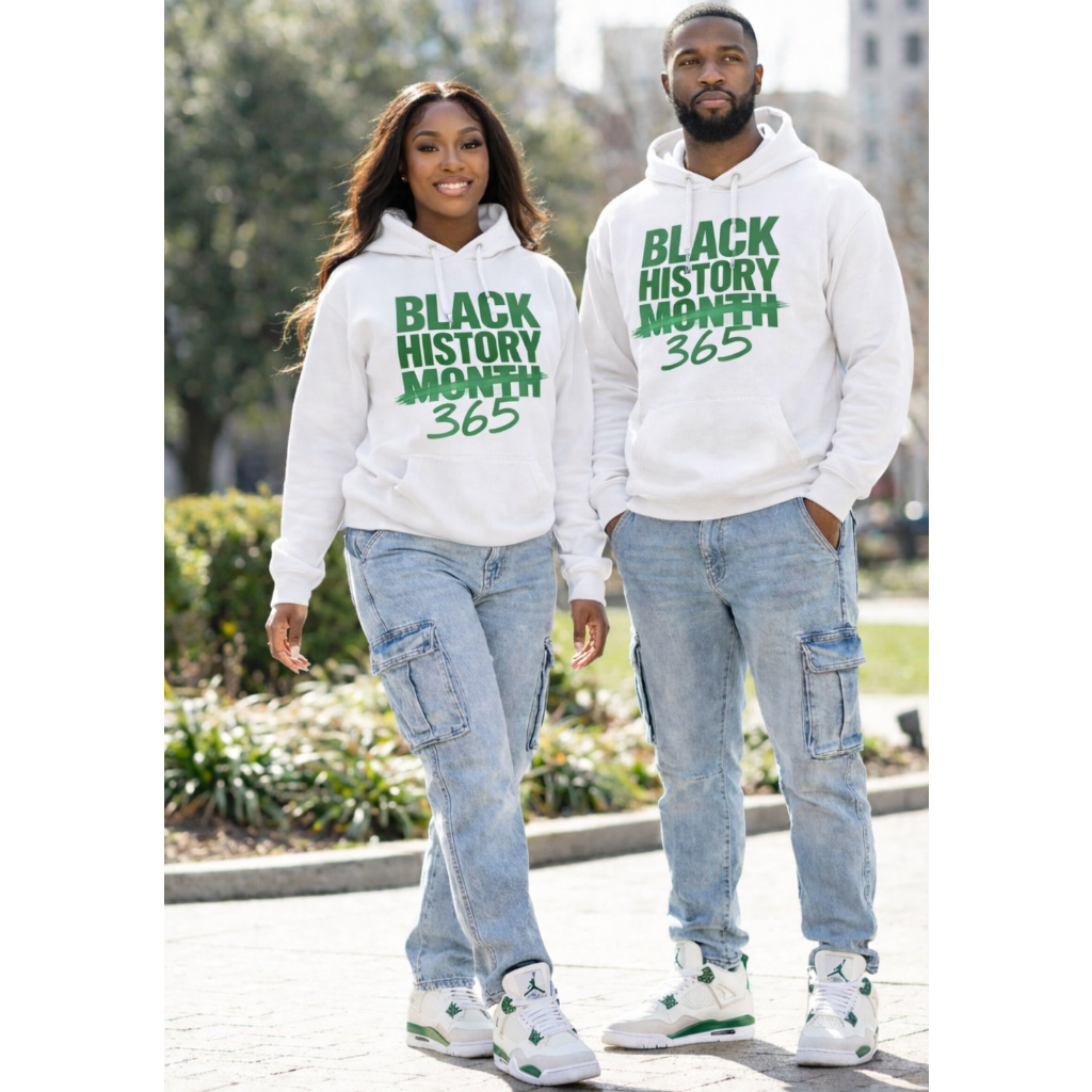 Two people wearing white hoodies with 'Black History Month 365' text, walking outdoors.