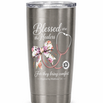 Silver tumbler with a design of a stethoscope, bow, and text on a white background