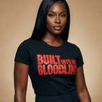 Person wearing a black t-shirt with 'BUILT INTO MY BLOODLINE' in red text on a beige background