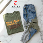 Green t-shirt with text and jeans on a marble surface with 'Thrive T-Shirt Apparel' branding.