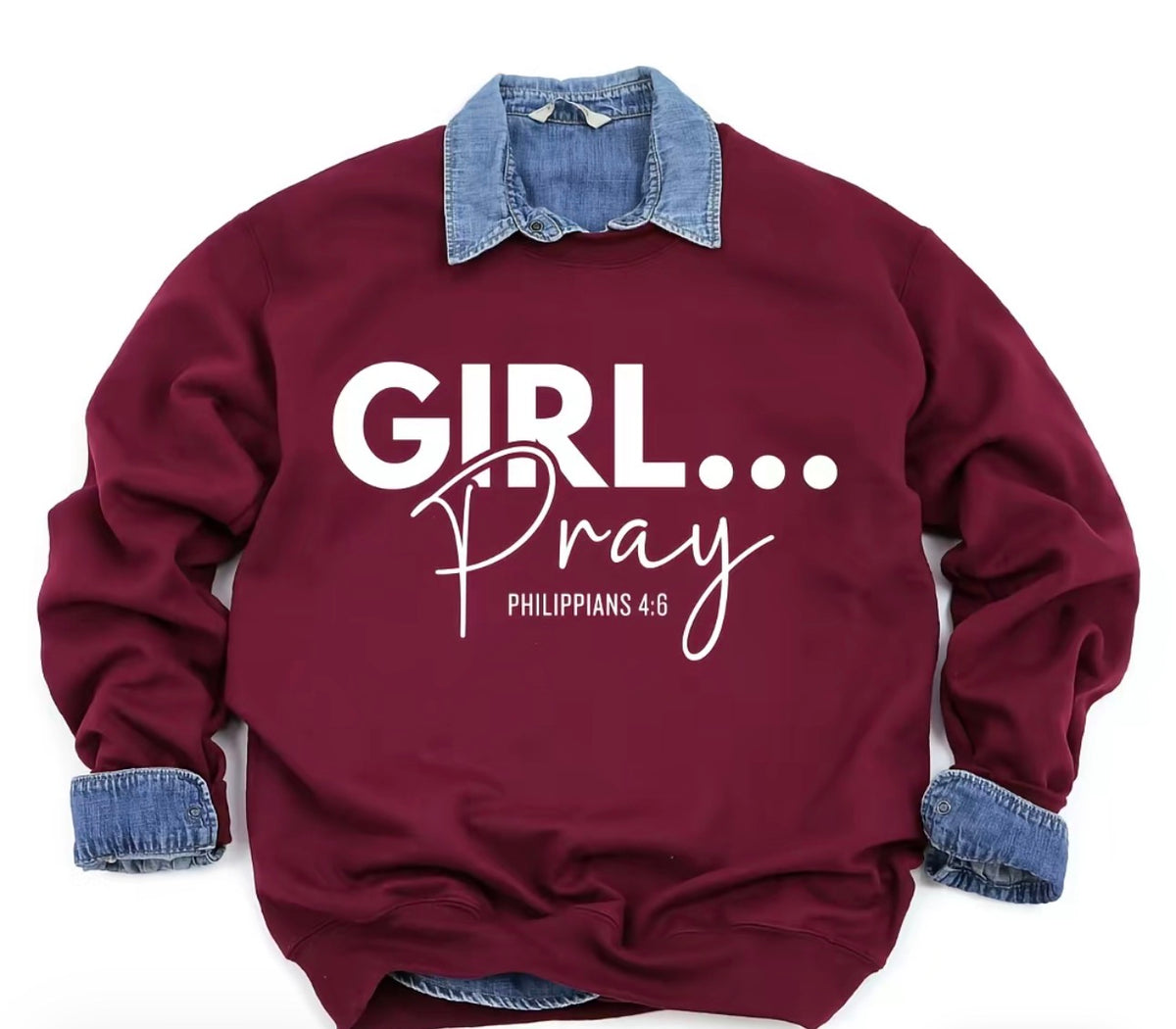 A maroon crewneck sweatshirt featuring a white graphic print that reads 'GIRL.