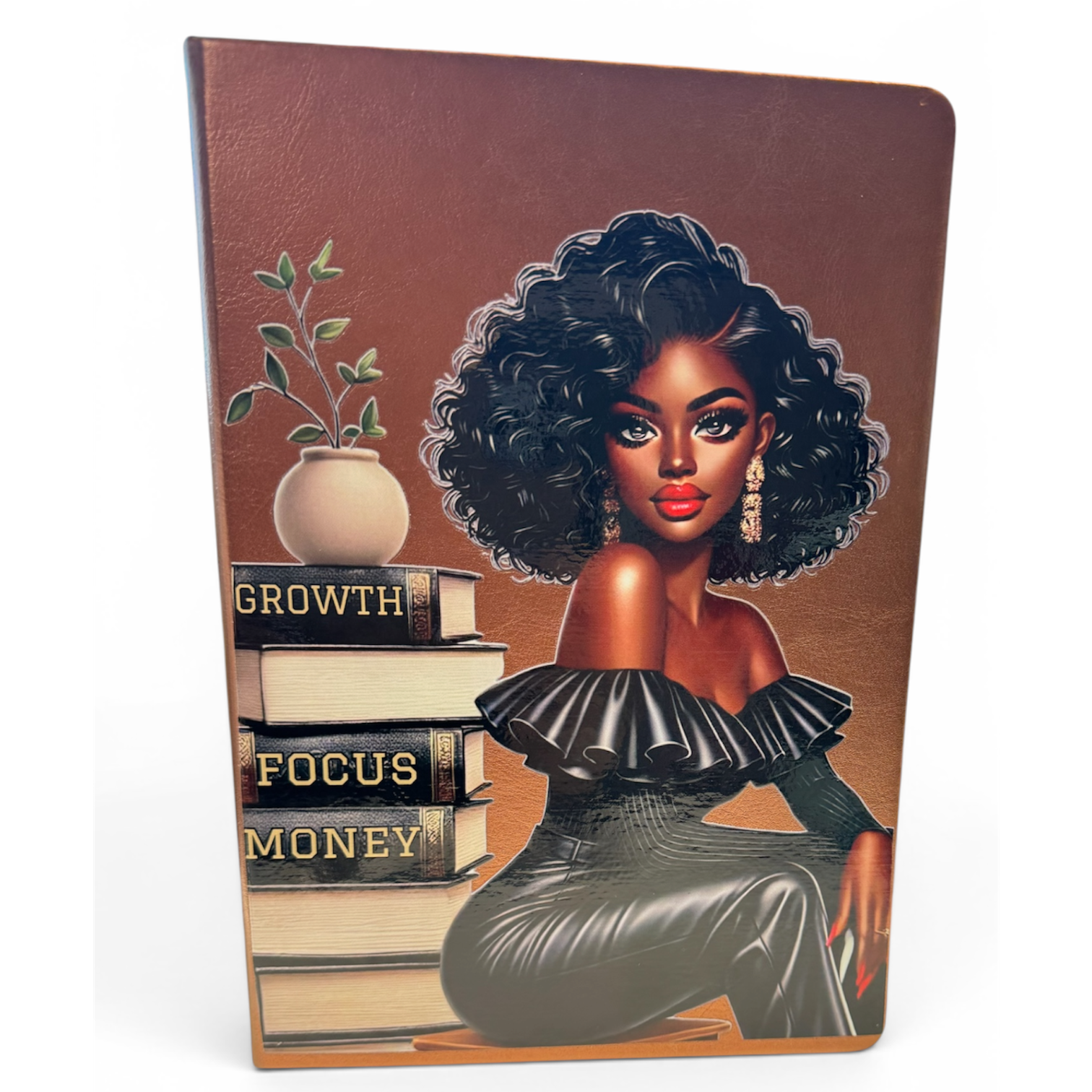 Notebook with a design of a woman, books, and a plant on the cover