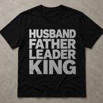 Black t-shirt with white text 'HUSBAND FATHER LEADER KING' on a beige background