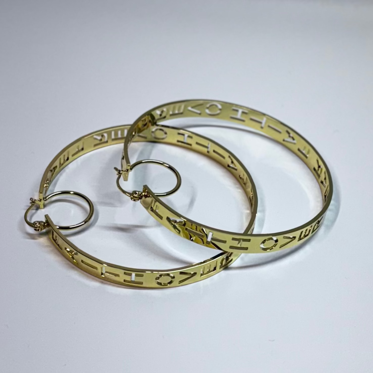 Gold hoop earrings on a light gray background FAITH OVER FEAR GOLD EARRINGS