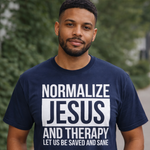 Man wearing a navy blue t-shirt with text in an outdoor setting