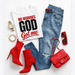 White t-shirt with 'No Worries God Got Me' text, red high-heeled boots, blue jeans, red handbag, sunglasses, and watch on a white background.