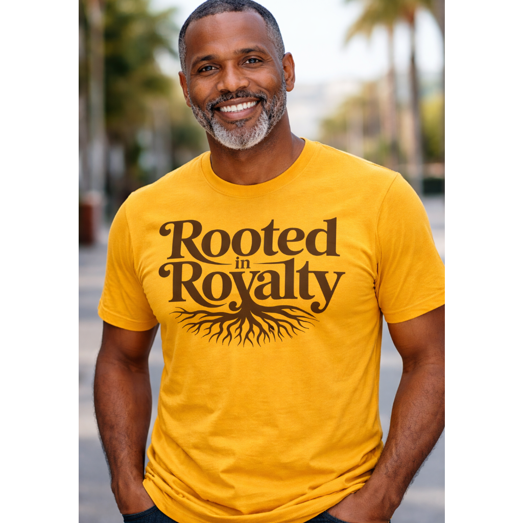 Man wearing a yellow t-shirt with 'Rooted in Royalty' text and tree graphic.