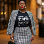 Woman wearing a black and white houndstooth patterned outfit with a graphic t-shirt.