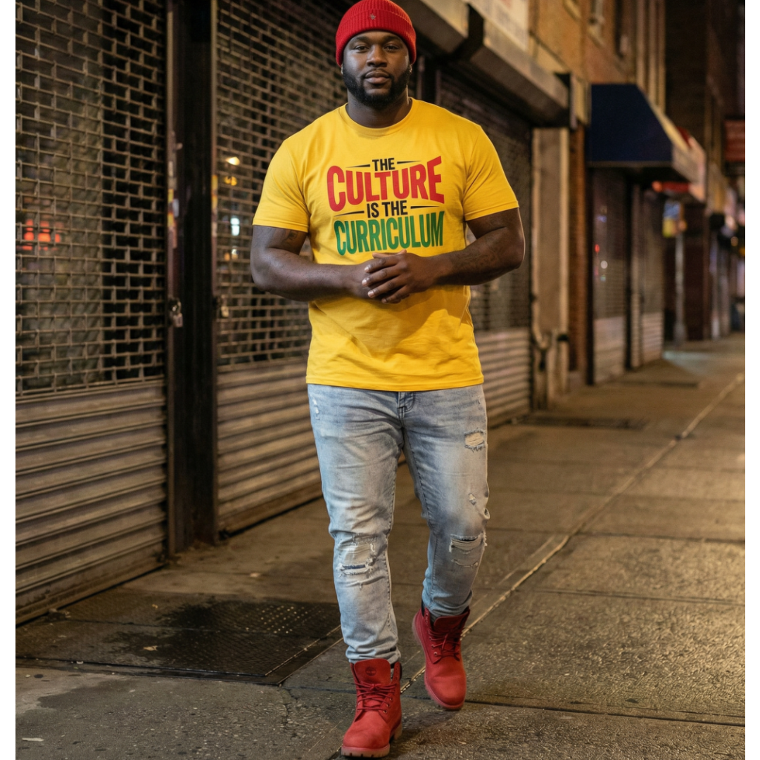Man wearing a yellow t-shirt with text, standing on a city street.