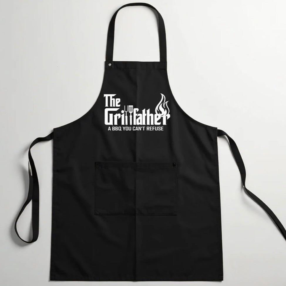 Black apron with 'The Grillfather' text on a gray background