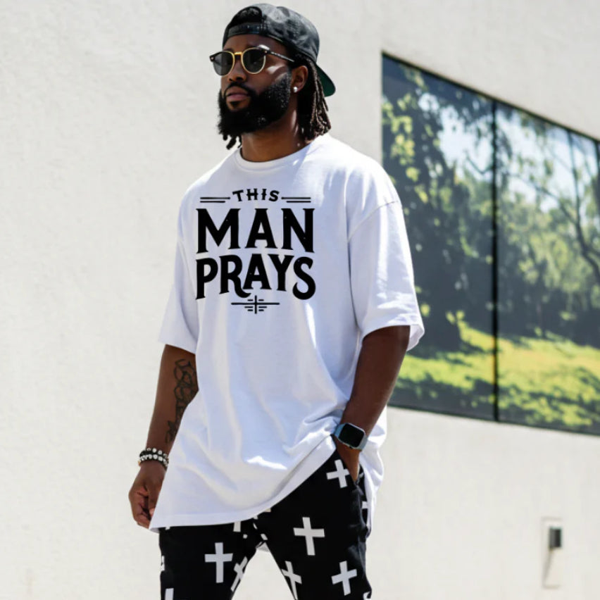 THIS MAN PRAYS T-SHIRT