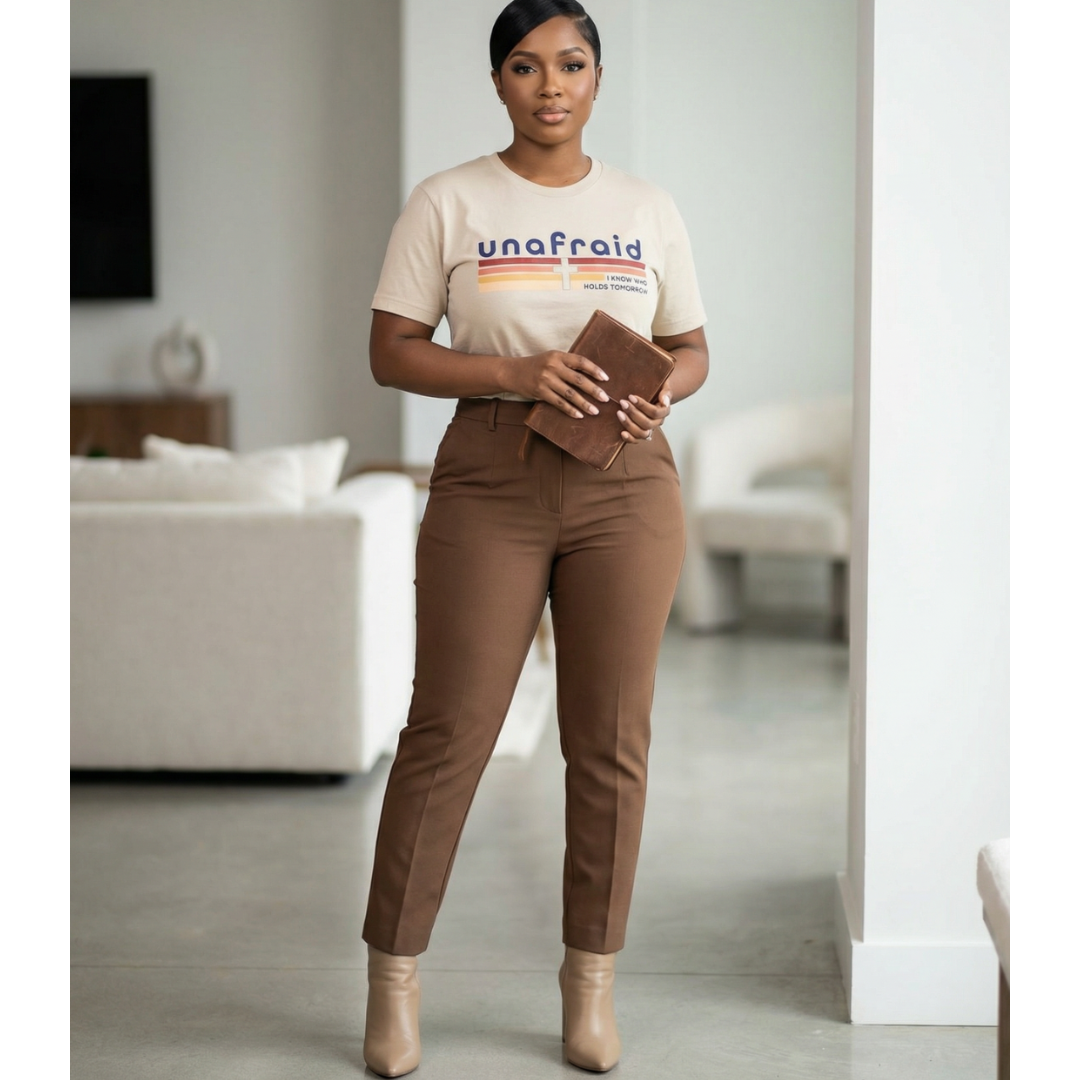 Woman wearing a 'unafraid' t-shirt in a living room setting