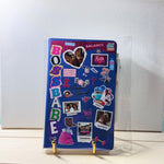 Decorative notebook with stickers on a white background