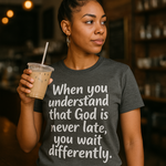 Woman wearing a t-shirt with a motivational quote in a coffee shop.
