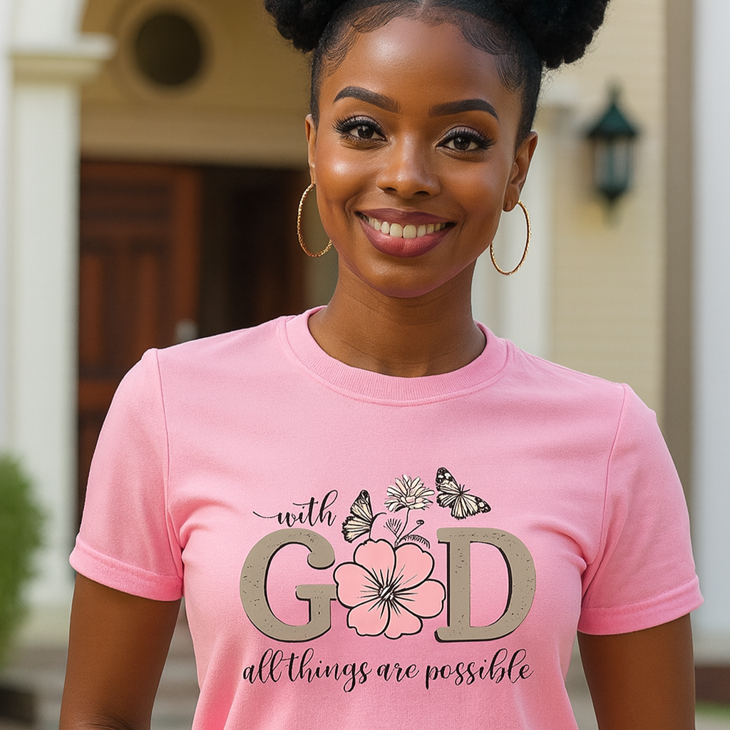 Woman wearing a pink t-shirt with a motivational quote and design.