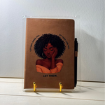 Brown notebook with an illustration of a woman and text on a white surface