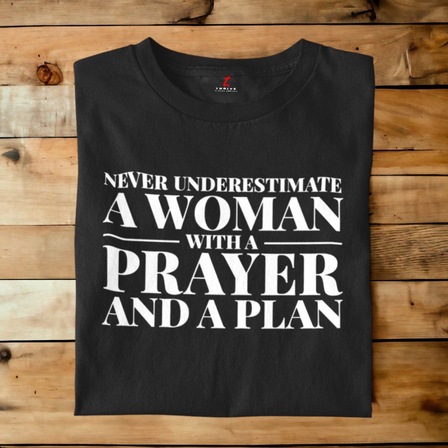 NEVER UNDERESTIMATE A WOMAN THRIVE T-SHIRT APPAREL