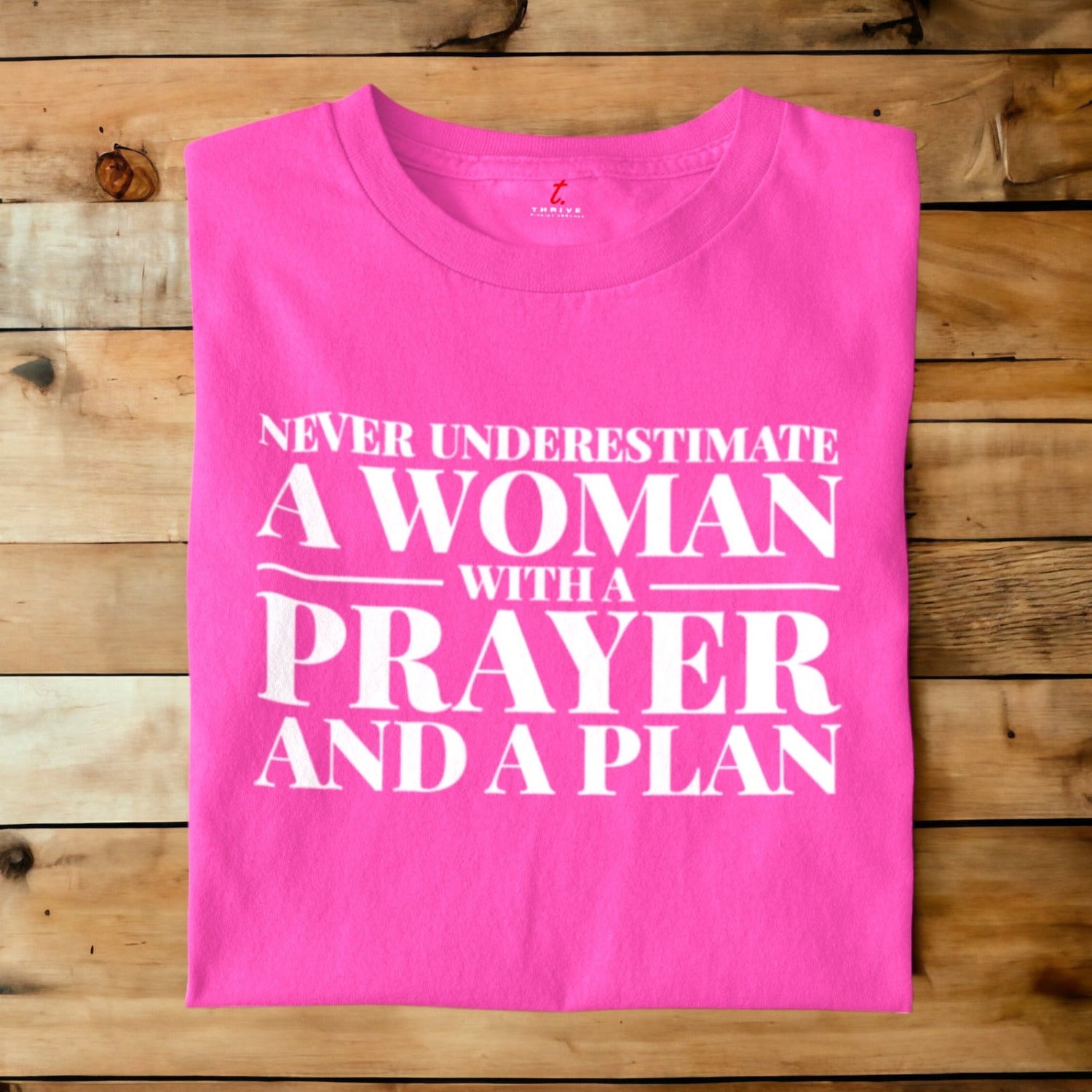 NEVER UNDERESTIMATE A WOMAN THRIVE T-SHIRT APPAREL